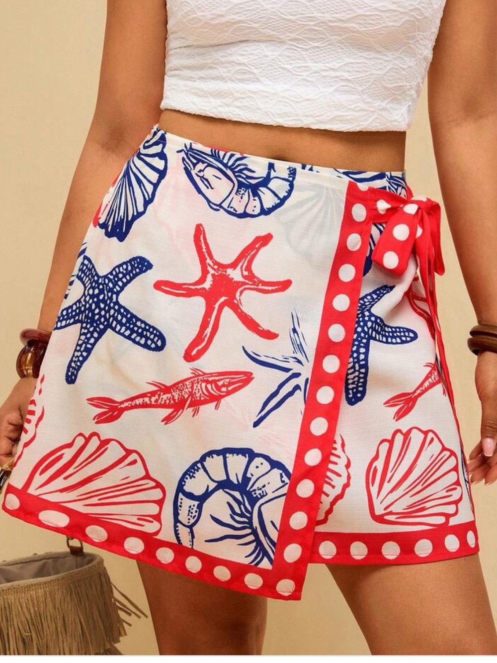 This Travachic sea creature print wrap skirt features blue and red design